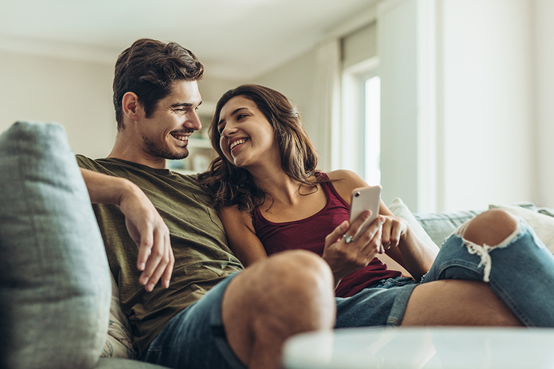 Couple sitting on the couch together